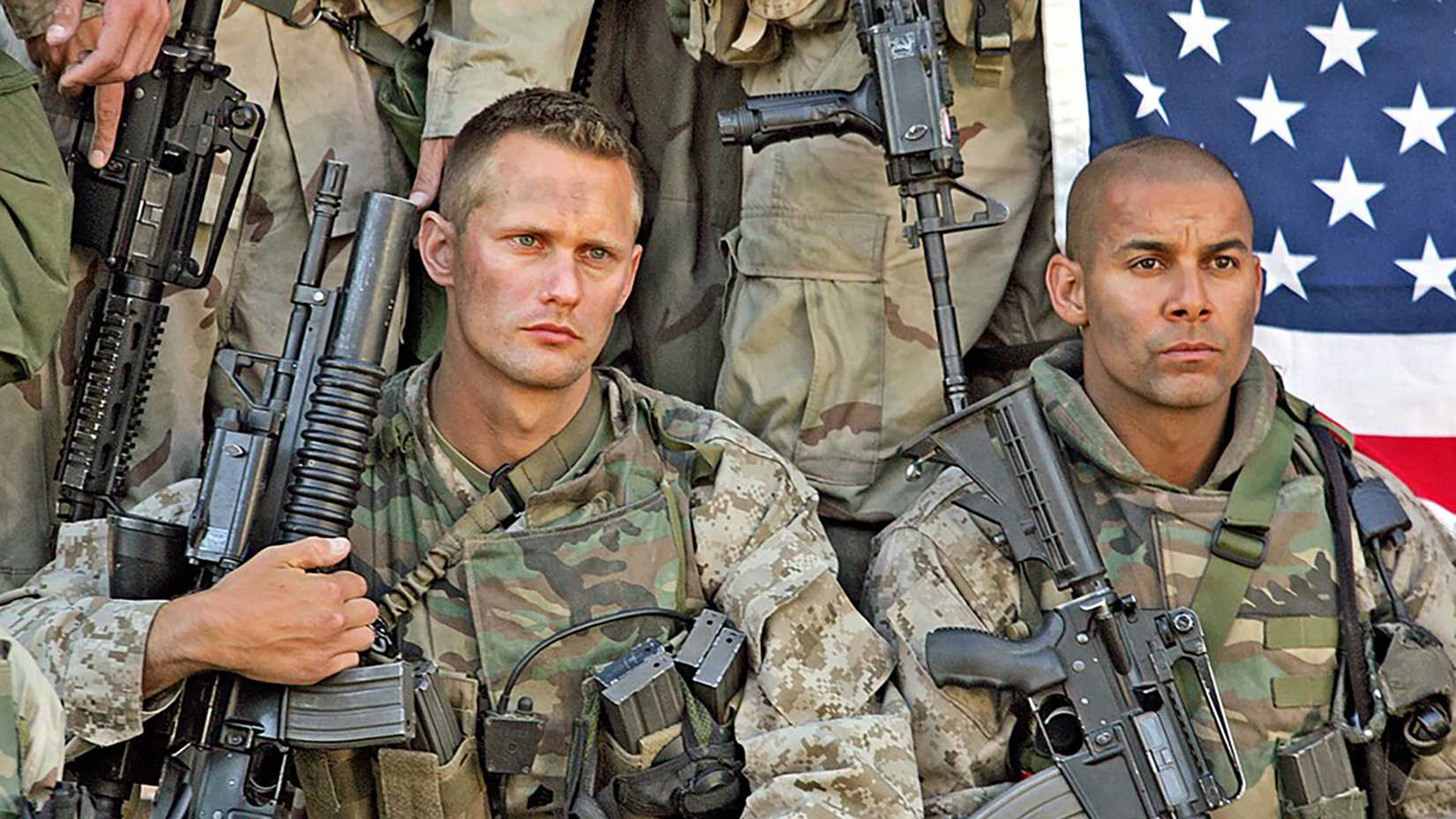 Iceman (Alexander Skarsgård) and Poke (John Huertas) posing for a photo in Generation kill thumbnail