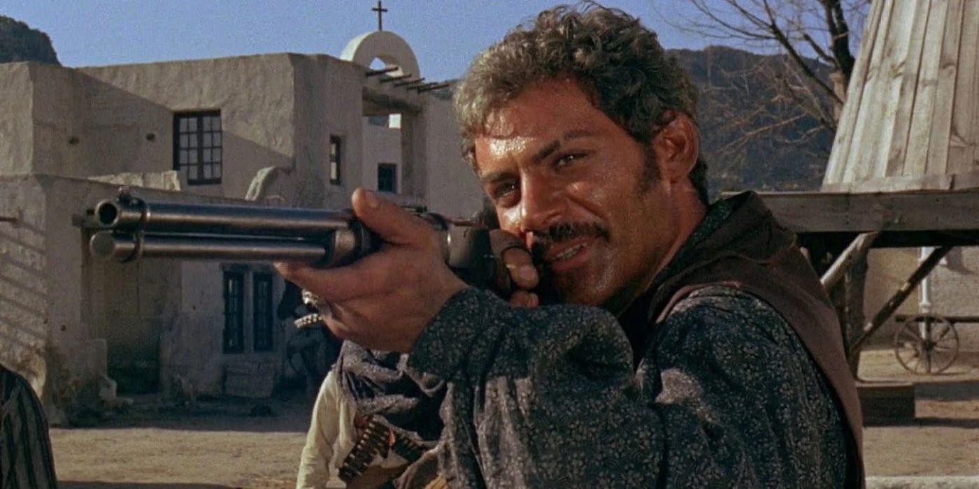 Gian Maria Volonté as Ramón Rojo aims a rifle in a scene from A Fistful of Dollars.