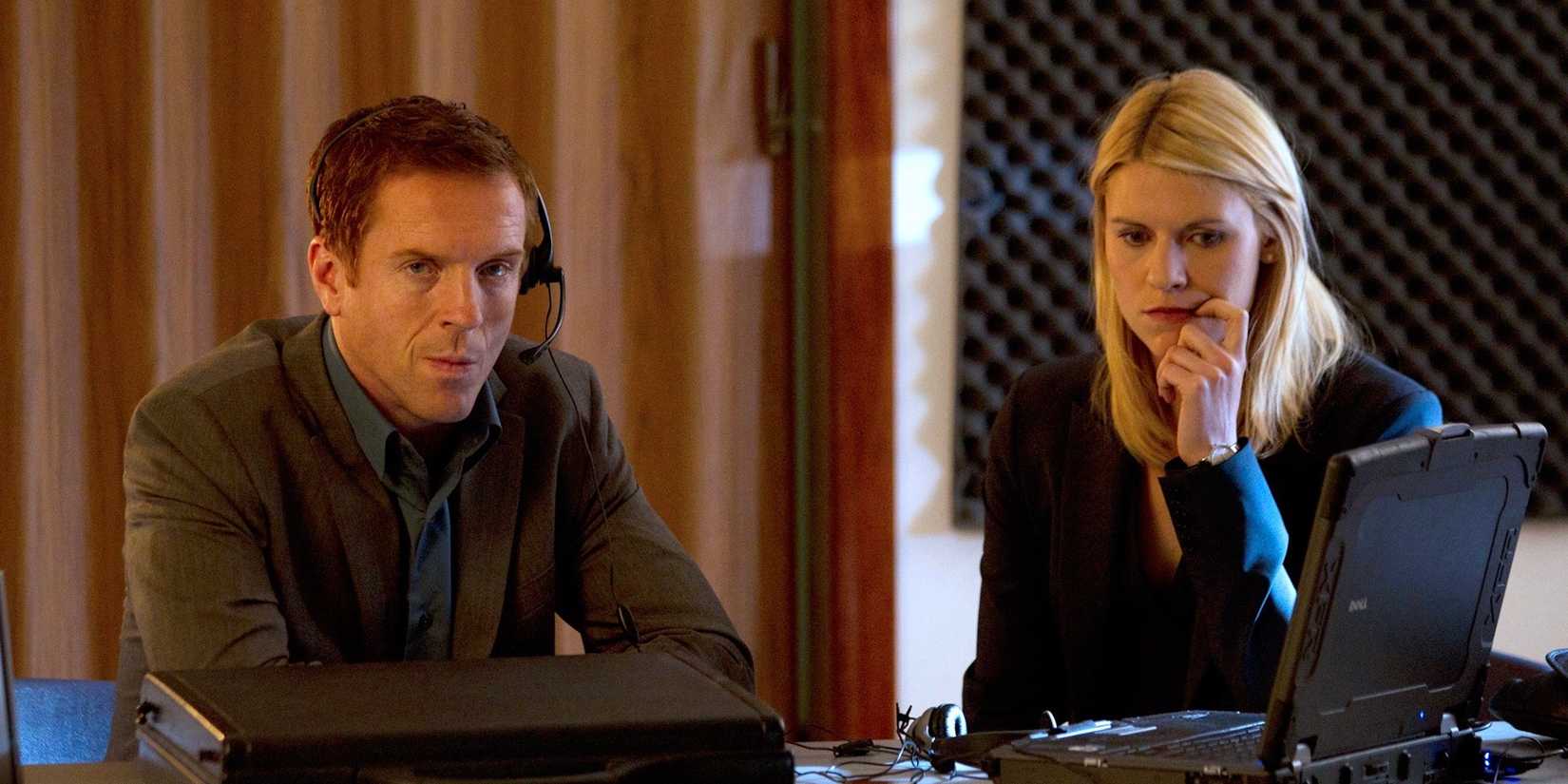 Nicholas Brody and Carrie Mathison sitting down with worried looks on their faces in Homeland season 1.