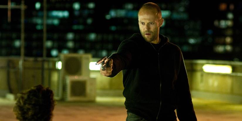 Jason Statham's Brant points a gun at Aiden Gillen's Blitz in 2011's Blitz movie