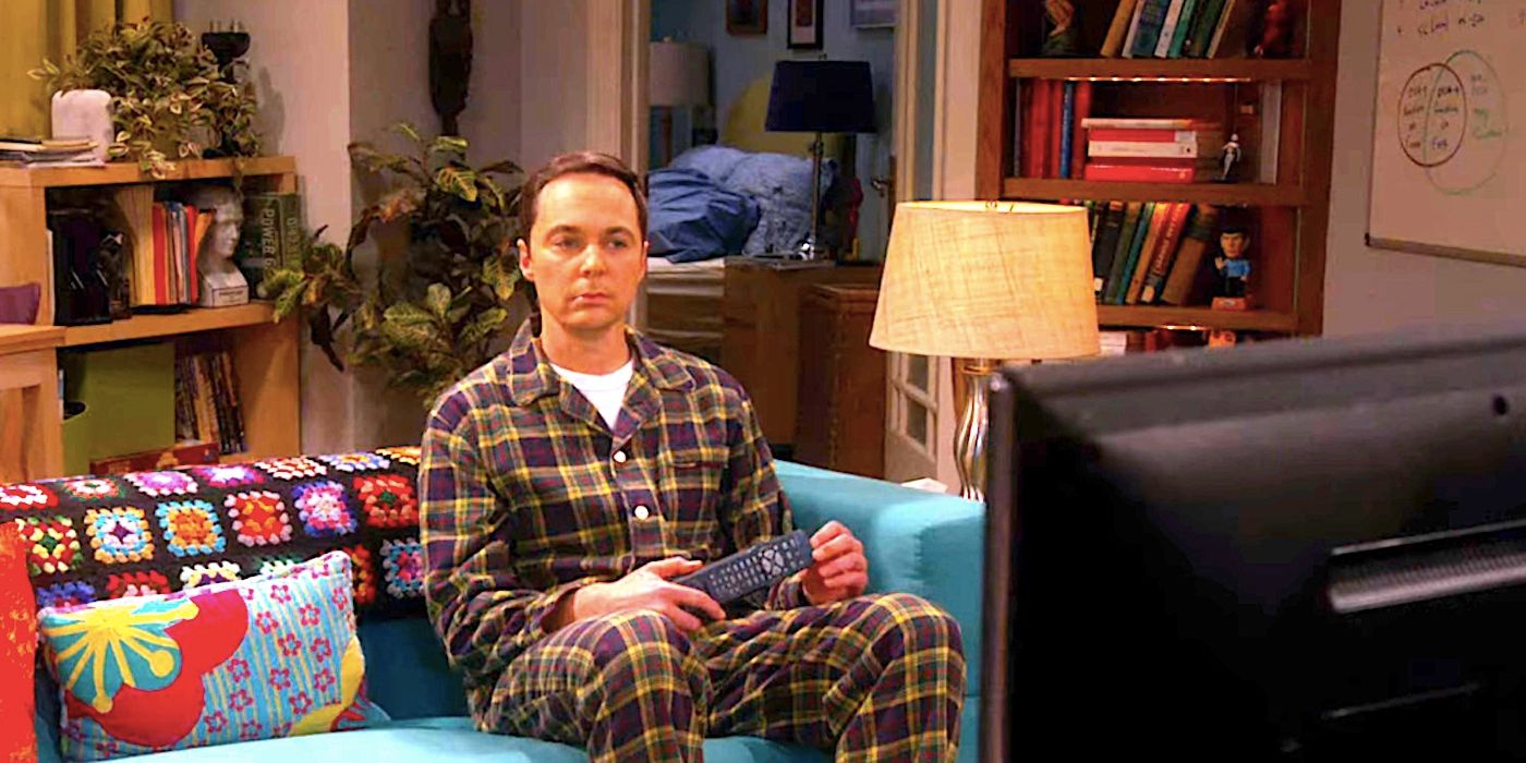 Jim Parsons' despondent Sheldon watches TV on the couch in The Big Bang Theory
