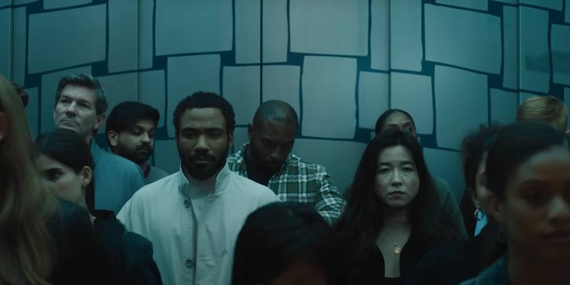 John (Donald Glover) and Jane (Maya Erskine) riding an elevator in Mr. & Mrs. Smith