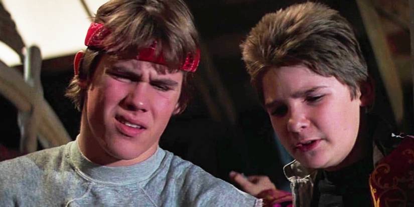 Josh Brolin looking confused with Corey Feldman in The Goonies