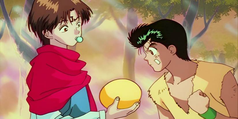 Koenma holds the spirit beast egg as Yusuke looks at it from Yu Yu Hakusho.