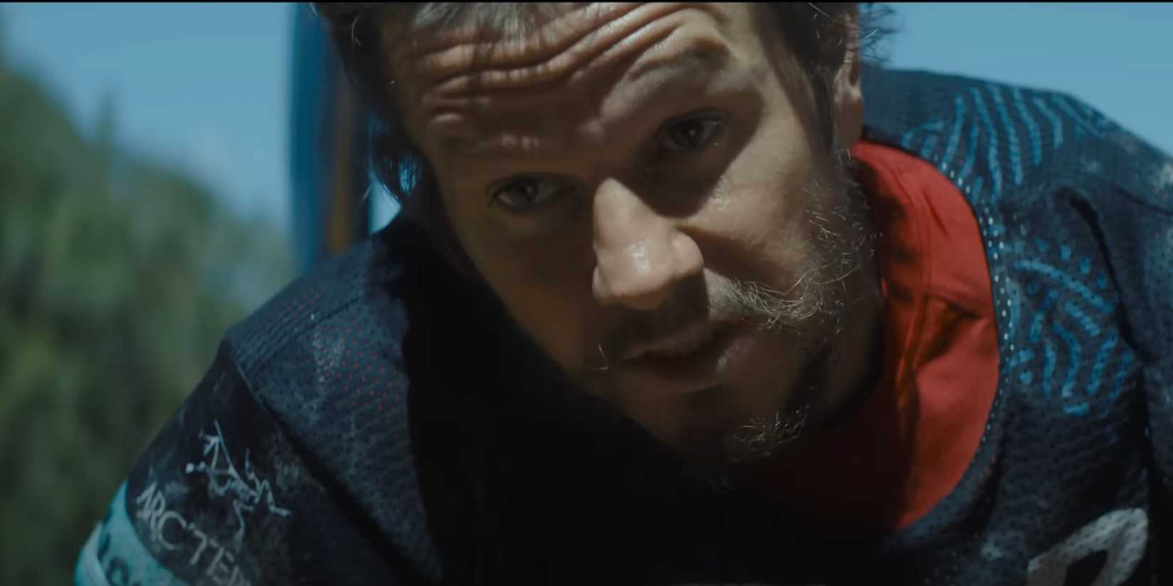 Mark Wahlberg as Mikael Lindnord bending down and talking to someone in Arthur the King