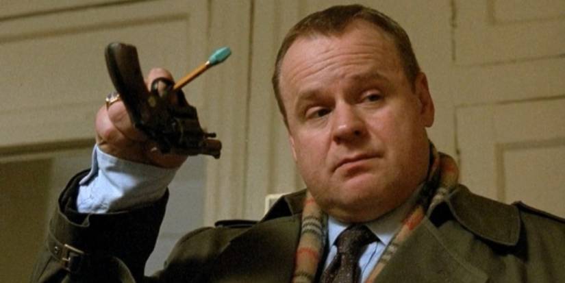 Max Greevey holding a gun with a pencil in Law & Order