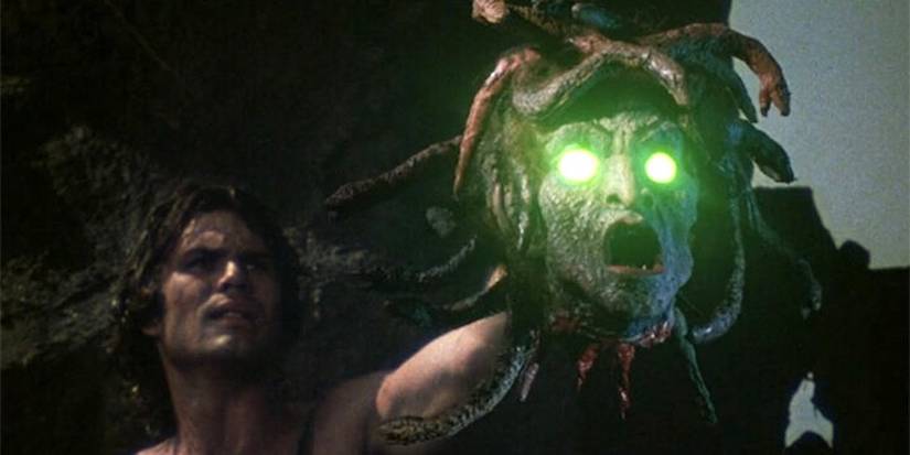 Perseus holding up Medusa's head with her glowing eyes in Clash of the Titans