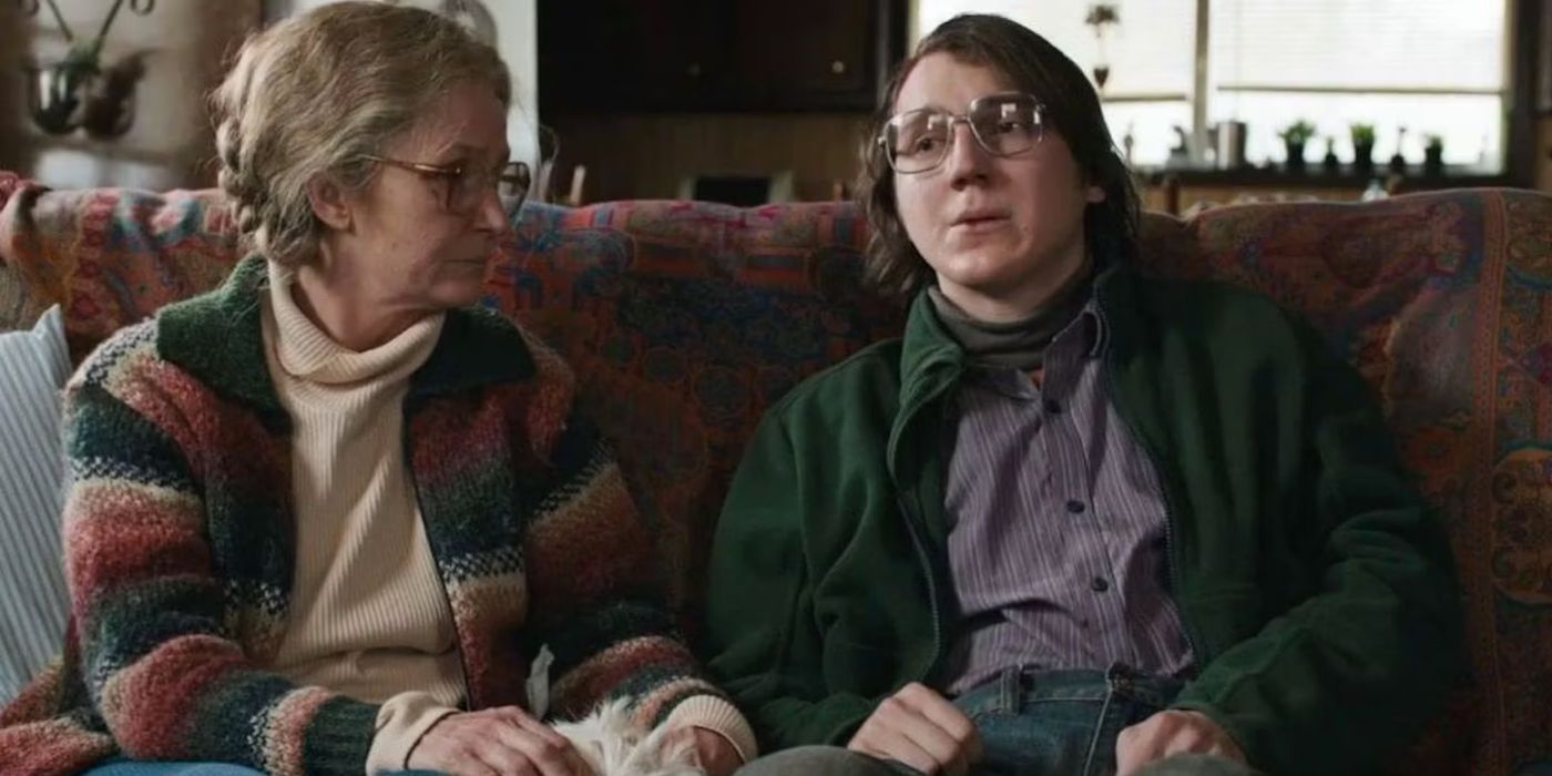 Melissa Leo as Holly and Paul Dano as Alex on a couch in Prisoners (2013)