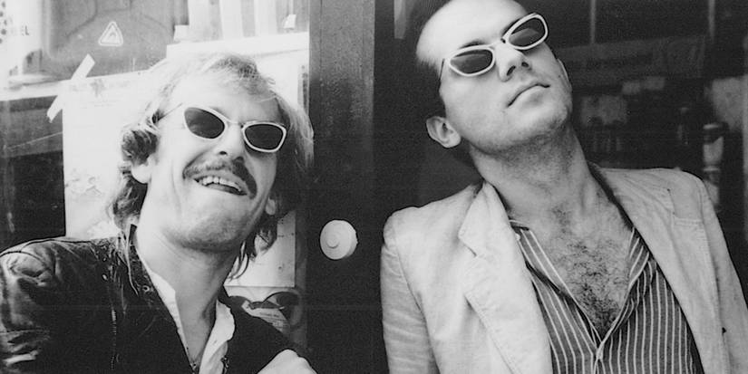 Rüdiger Vogler as Bruno Winter and Hanns Zischler as Robert Lander wearing matching sunglᴀsses in Kings of the Road