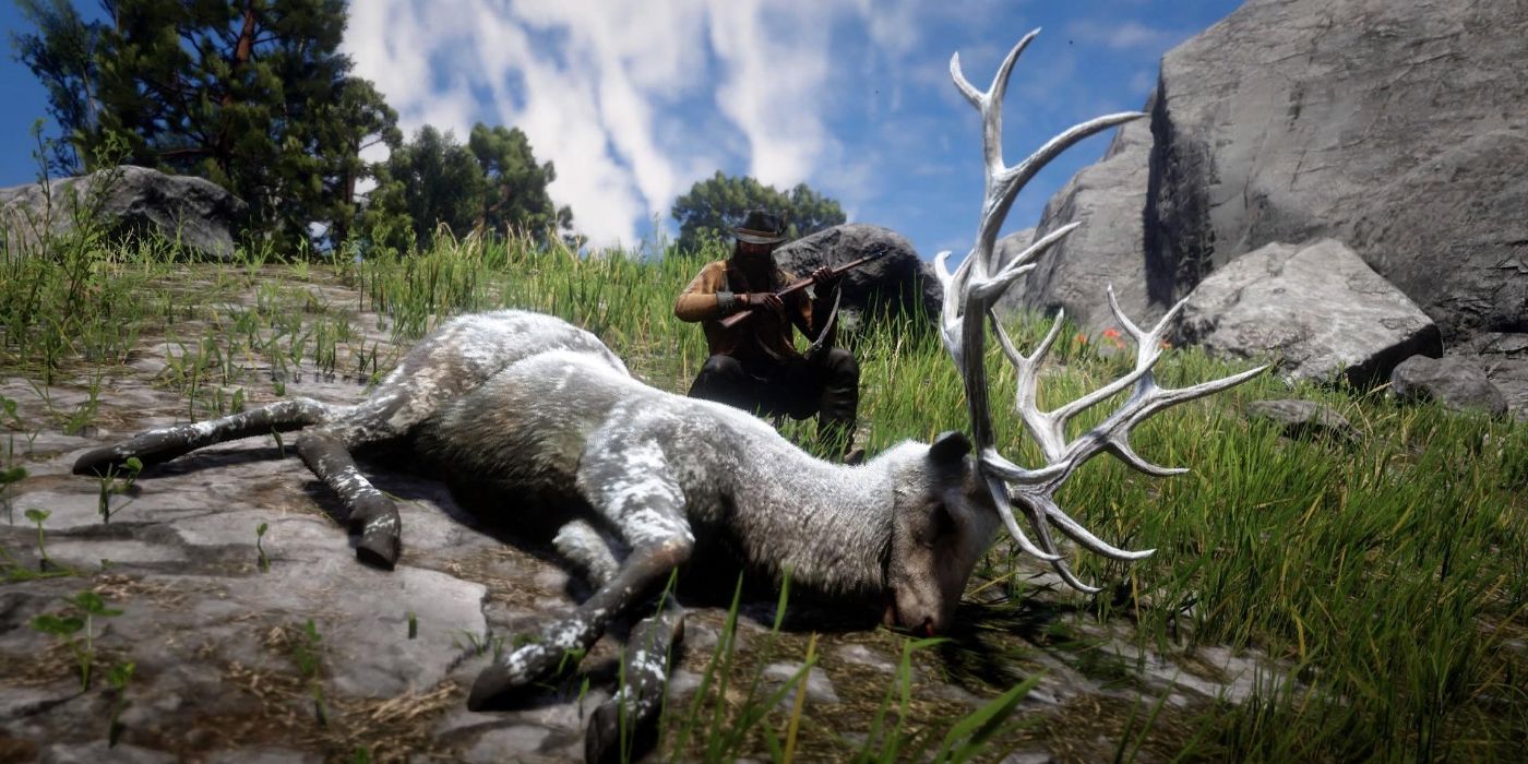 Arthur kneeling behind a dirty Legendary Elk carcass in Red Dead Redemption 2