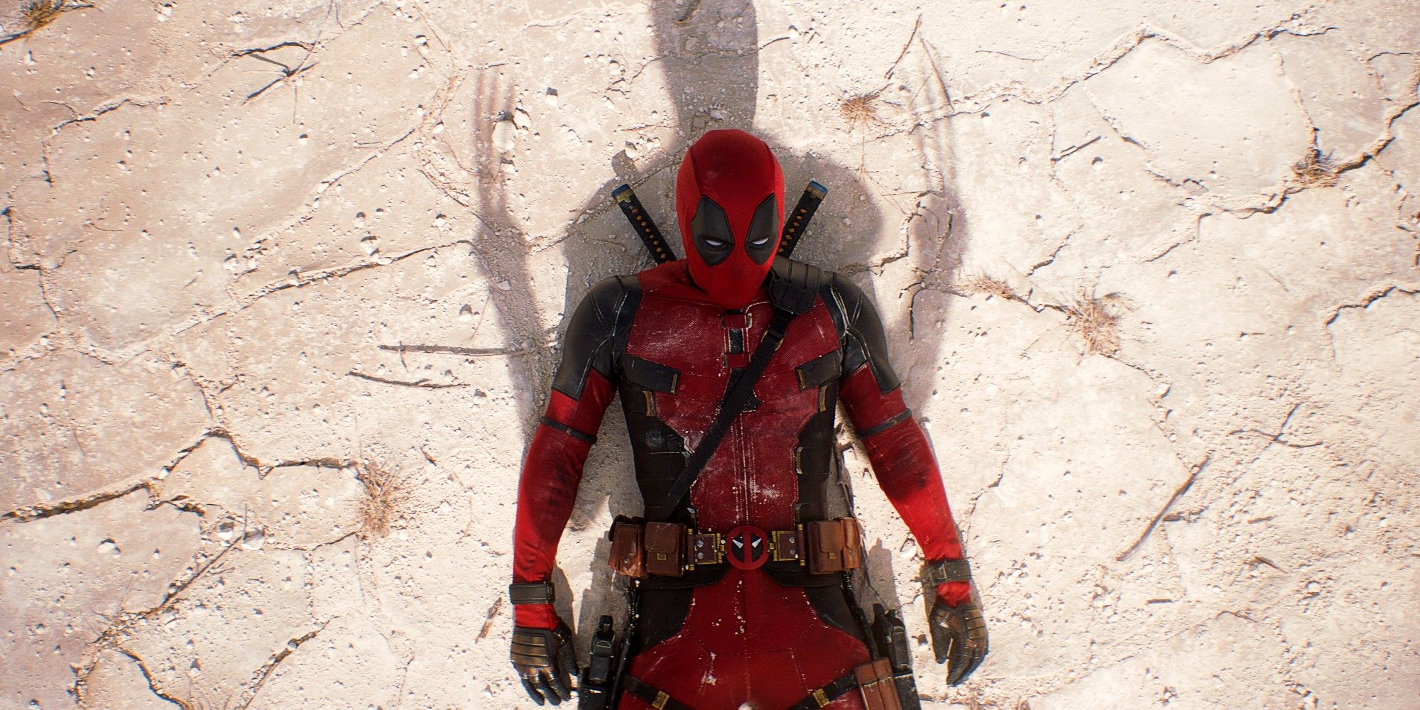 Ryan Reynolds As Deadpool Laying Down On Dry Ground Covered By Shadow of Wolverine And His Claws In Deadpool and Wolverine