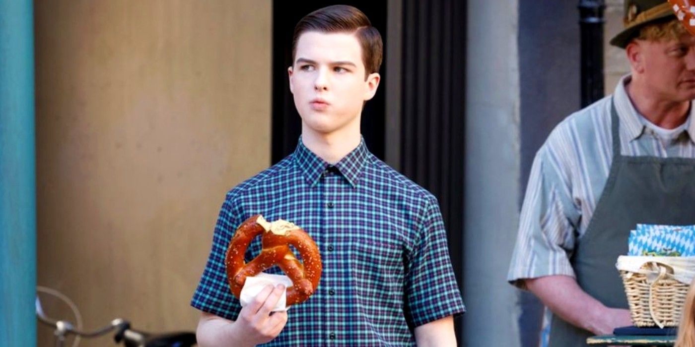 Iain Armitage as Sheldon eating a pretzel in Germany in Young Sheldon season 7