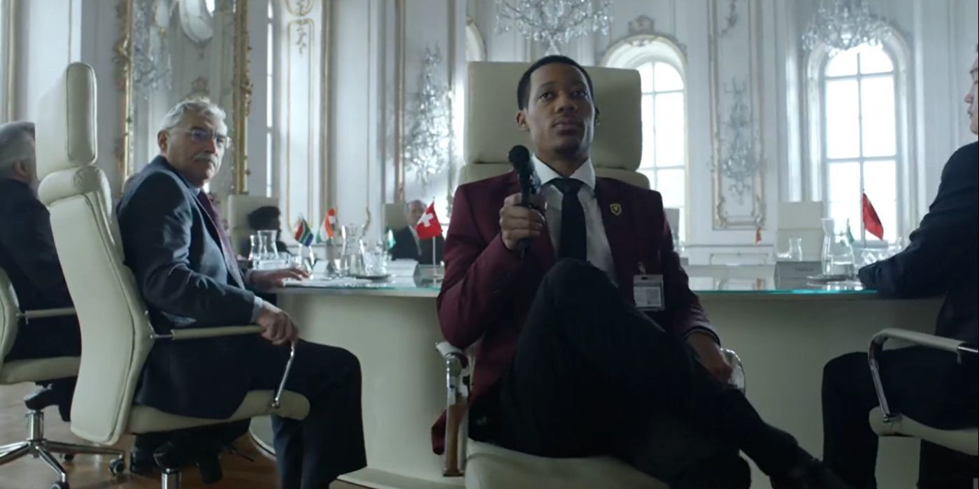 Standish (Tyler James Williams) pointing a gun in an all white room in the Whiskey Cavalier season finale.