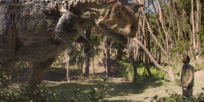 A man coming face-to-face with a dinosaur in Terra Nova