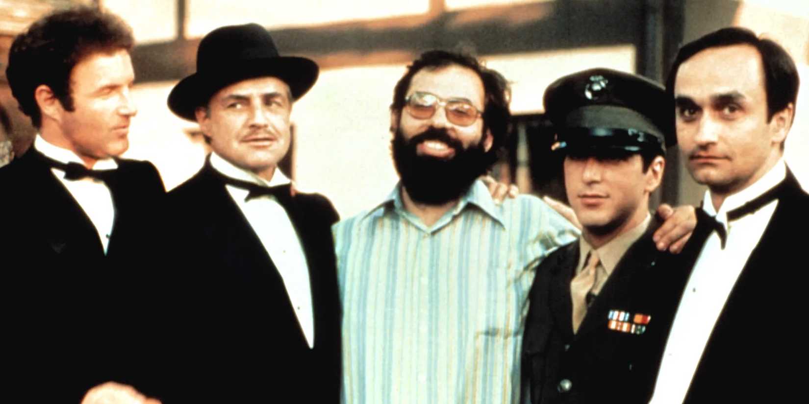Francis Ford Coppola posing with the cast of The Godfather