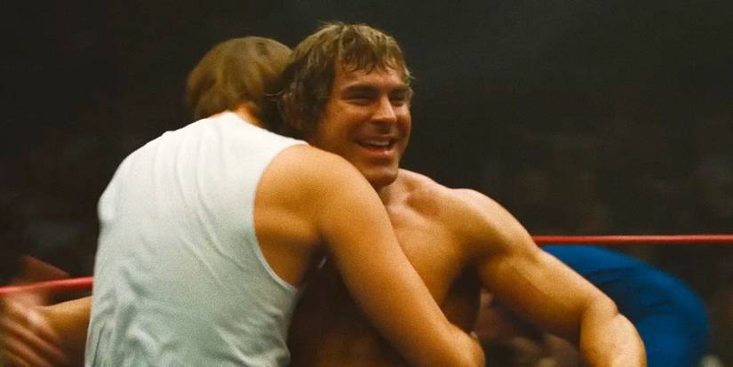 Zac Efron celebrating and hugging somebody in The Iron Claw