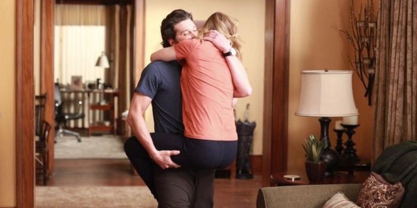 Derek carrying Meredith through their living room in Grey's Anatomy