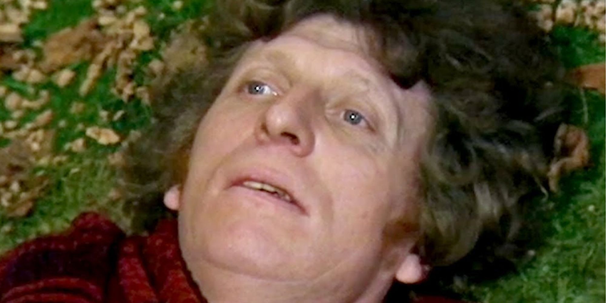 Tom Baker as the Fourth Doctor on the ground during his Doctor Who regeneration scene.