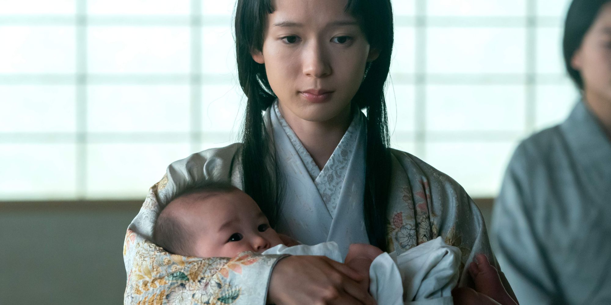 Usami Fuji holding her baby in her arms in Shogun episode 1