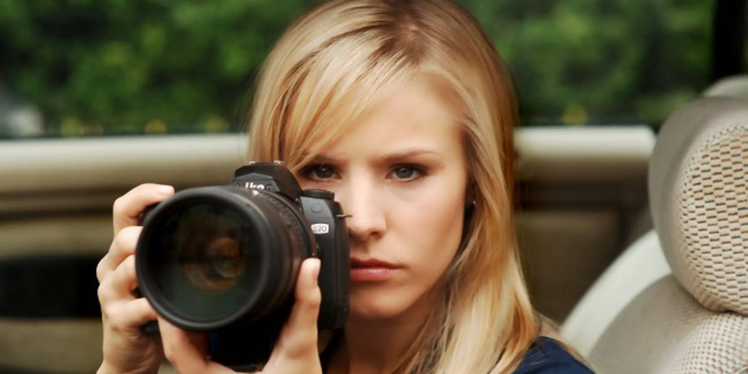 Kristen Bell as Veronica Mars holding a camera