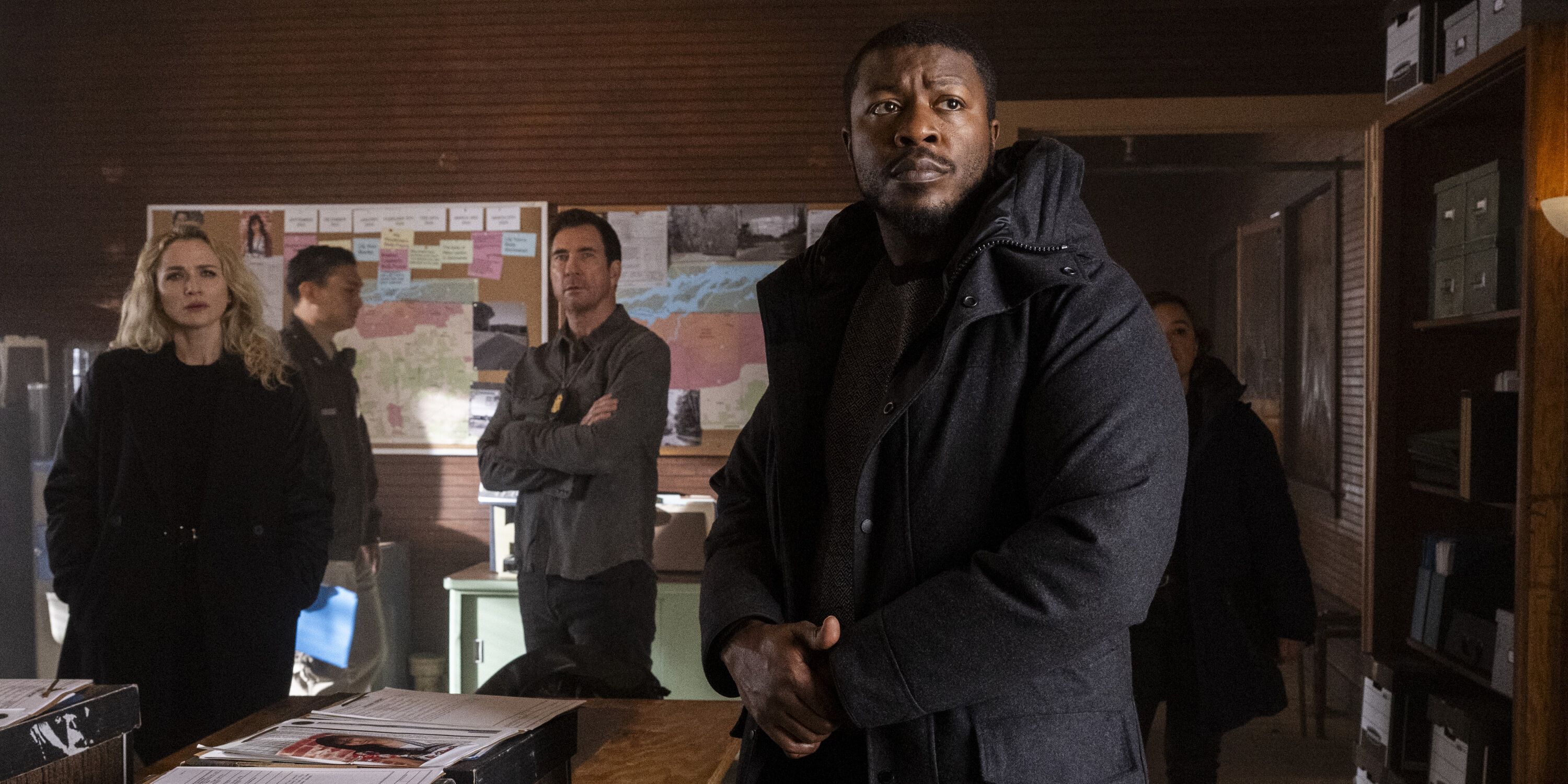 Shantel VanSanten as Special Agent Nina Chase, Dylan McDermott as Supervisory Special Agent Remy Scott, and Edwin Hodge as Special Agent Ray Cannon look on in the situation room in FBI: Most Wanted.