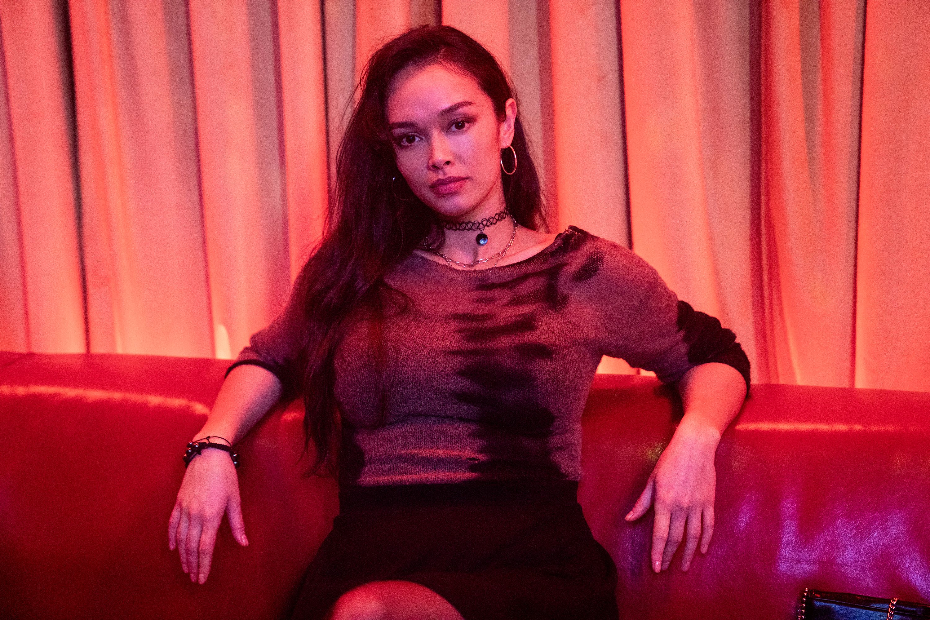 Vinessa Vidotto as Special Agent Cameron Vo sitting down in FBI: International.