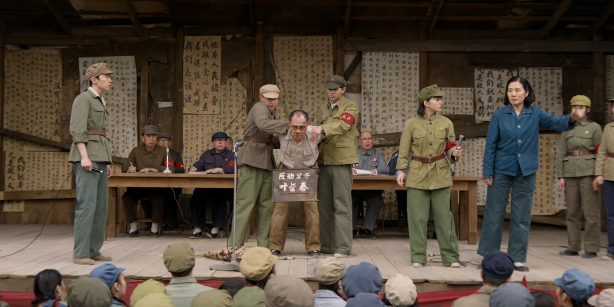 Ye Wenjie's father being held captive on a stage during the Chinese Cultural Revolution in 3 Body Problem