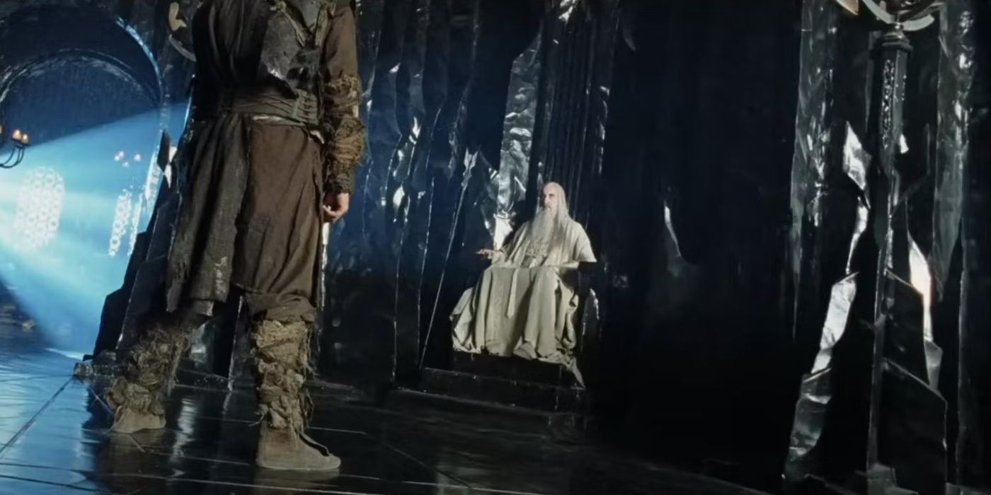 A Wildmen stands before Saruman in LOTR The Two Towers