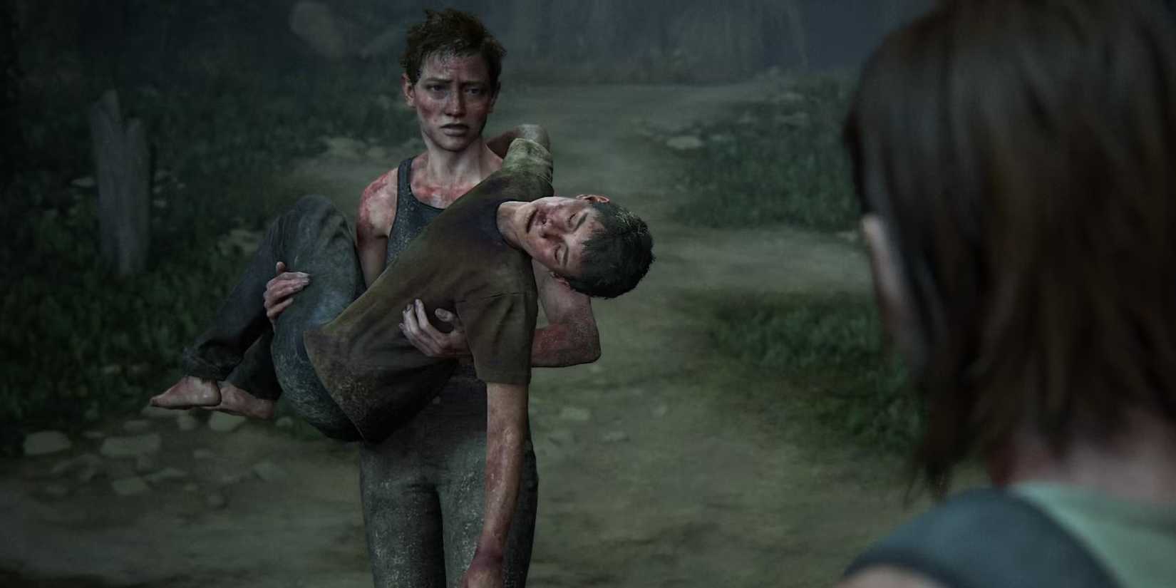 Abby carrega Lev na praia em The Last of Us Part II