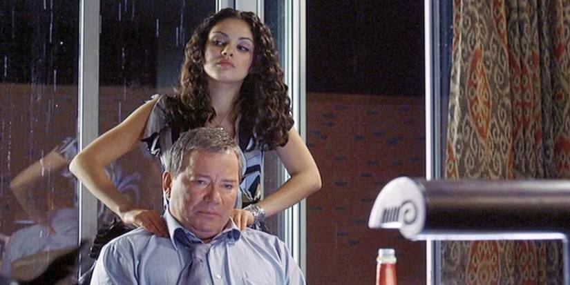 Mila Kunis as Rachael mᴀssaging William Shatner as Starkman's shoulders in American Psycho 2