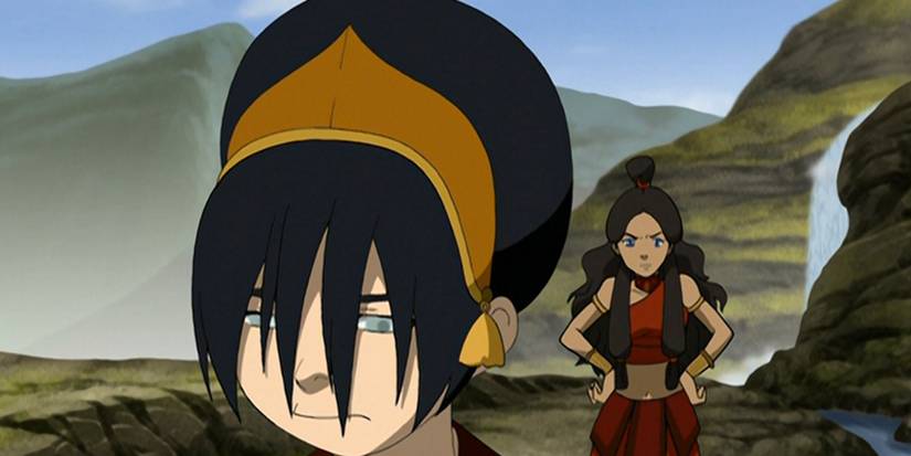 An angry Katara stands behind an upset Toph in the animated Avatar The Last Airbender episode The Runaway