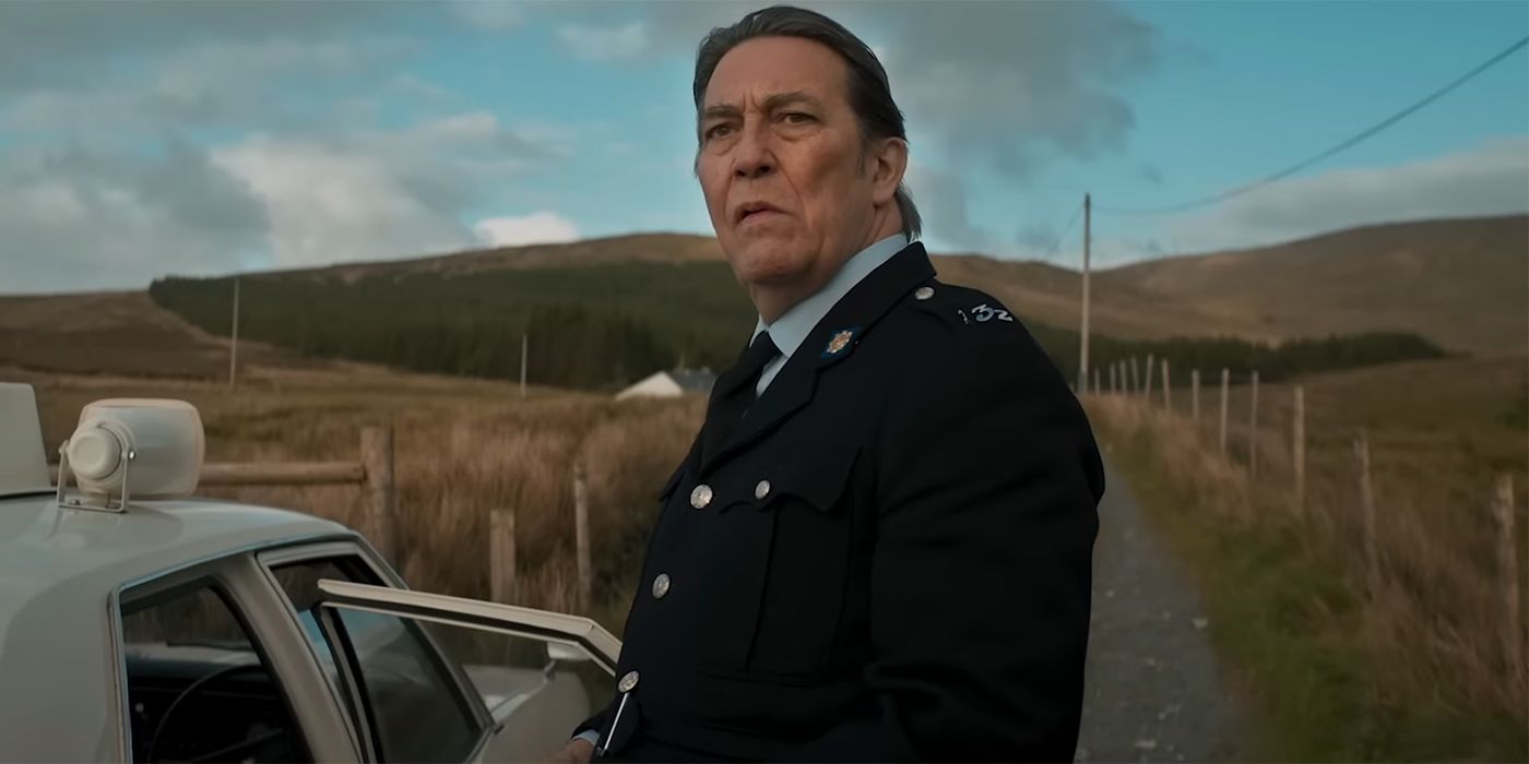 Ciarán Hinds as Vinnie O'Shea looking serious in In the Land of Saints and SInners