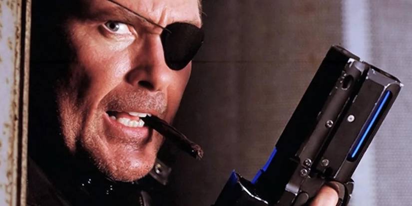 David Hasselhoff smoking a cigar and holding up a pistol in Nick Fury Agent of SHIELD (1998)