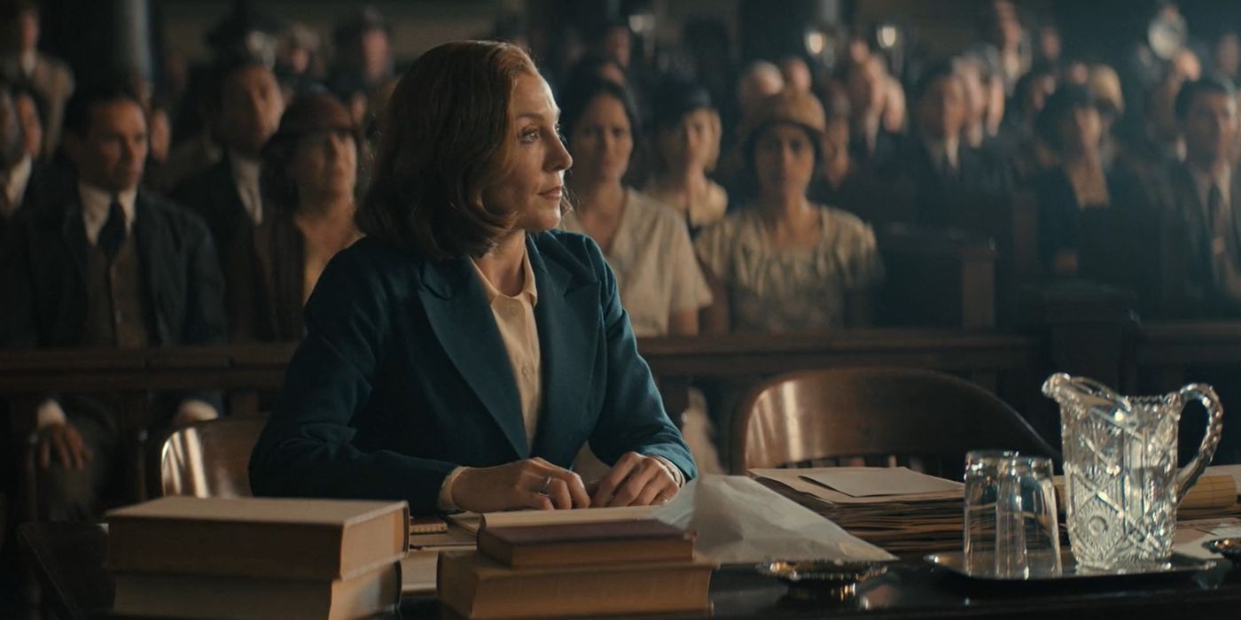 Della Street (Juliet Rylance) at a desk in court in Perry Mason season 2, episode 6.