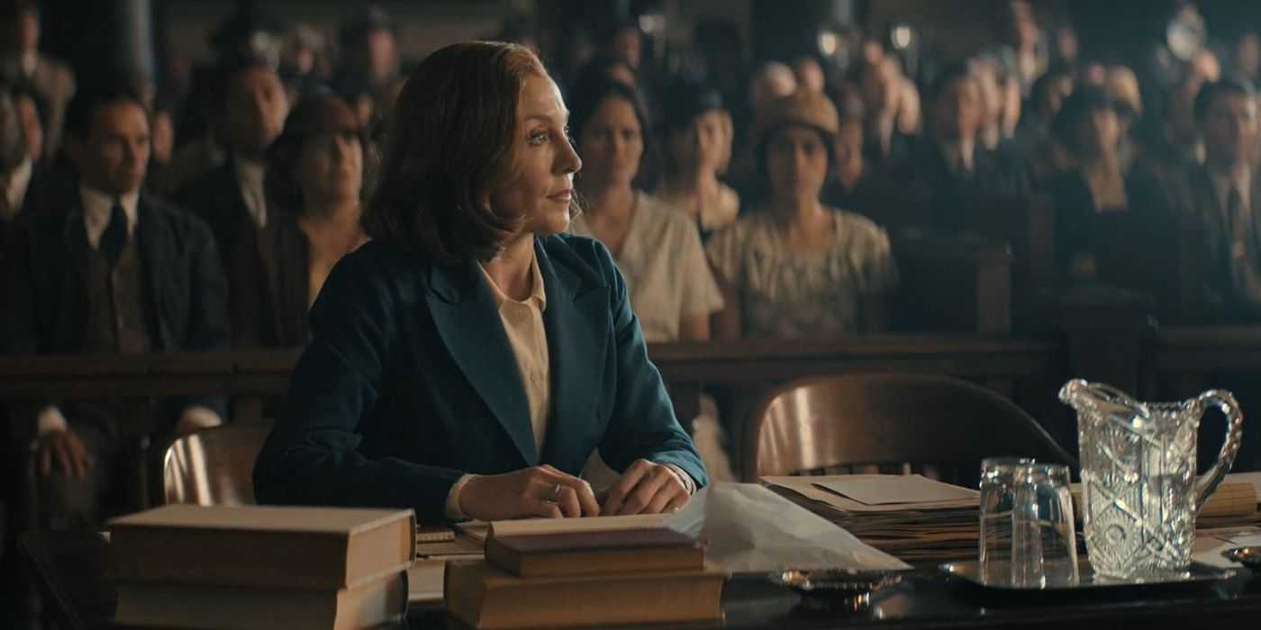 Della Street (Juliet Rylance) at a desk in court in Perry Mason season 2, episode 6.