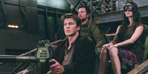 Jayne, Mal, River sat together peering at something in the distance as they prepare for a job in Firefly