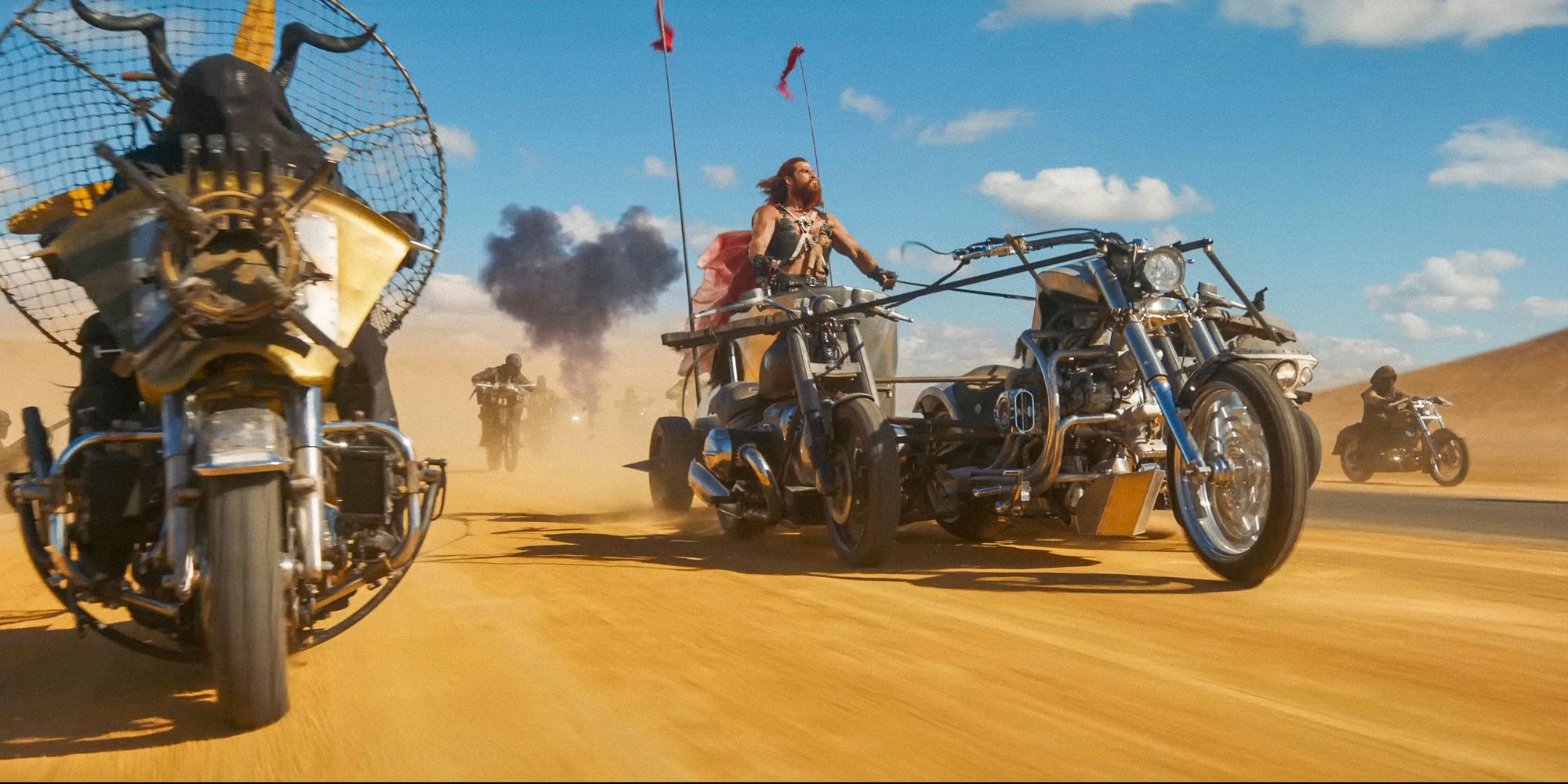 Dementus riding a pretty ridiculous triple motorcycle lol in Furiosa: A Mad Max Saga