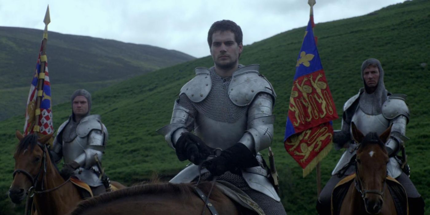 Henry Cavill as Charles Brandon with two other men, all in armor and on horseback in The Tudors 