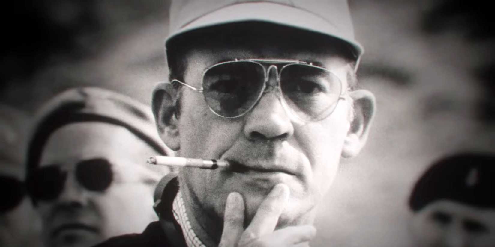 Hunter S Thompson smoking a cigarette.