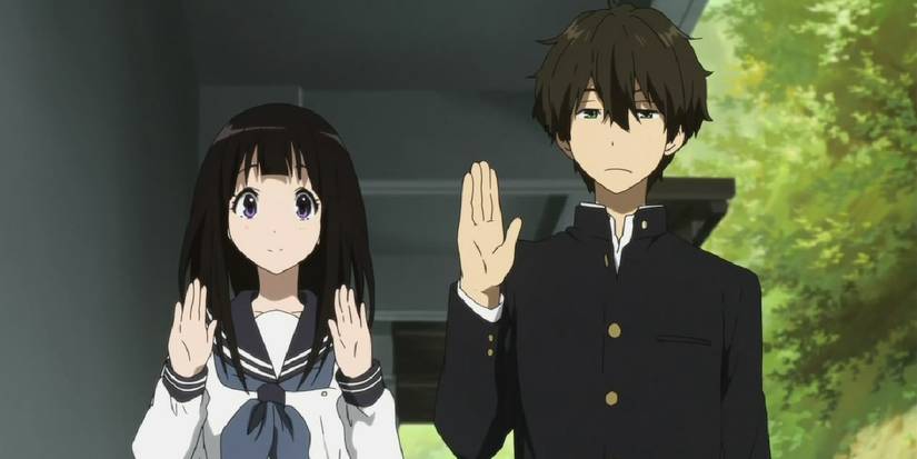 Hyouka's main characters holding their hands up.