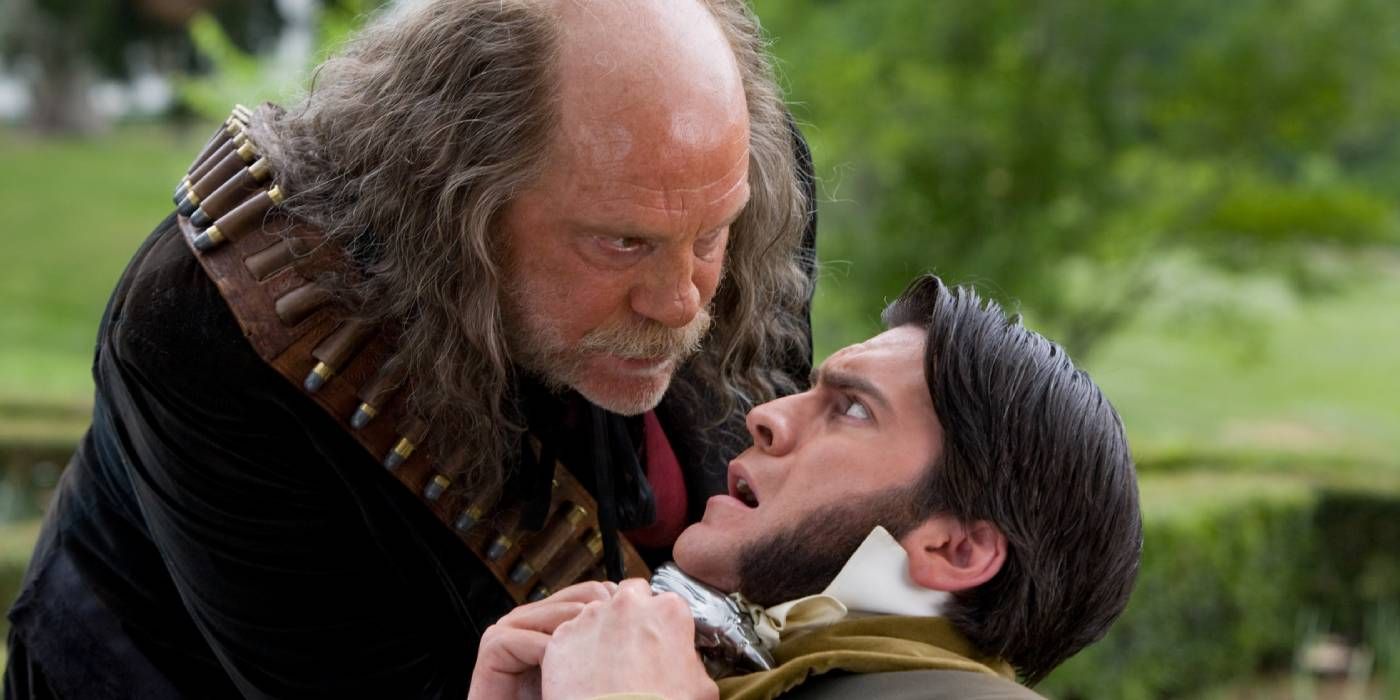 John Malkovich as Quentin leans over Wes Bentley in Jonah Hex 2010