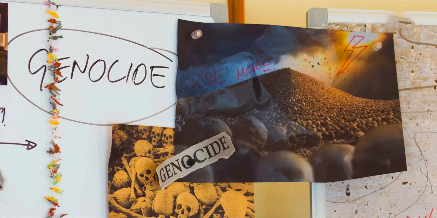 a shot of a poster with genocide writing on it from Kaos