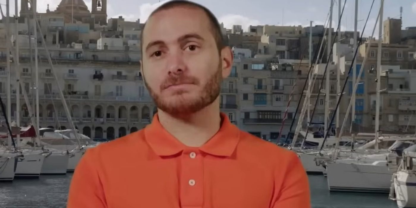 Kyle in 90 Day Fiance wearing orange shirt with serious expression