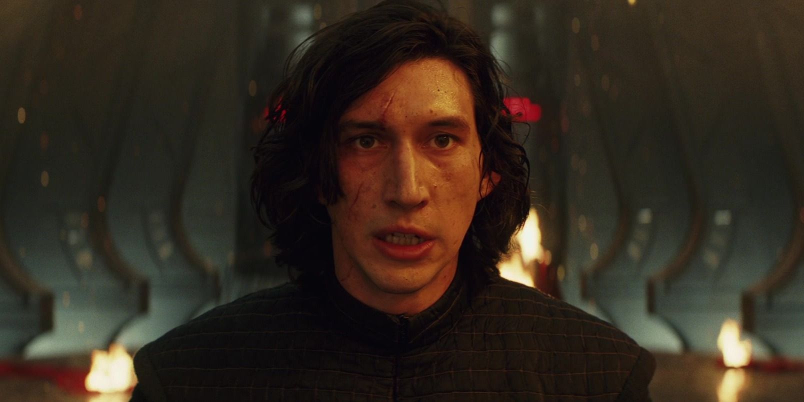 Kylo Ren looking angry with the wrecked throne room behind him