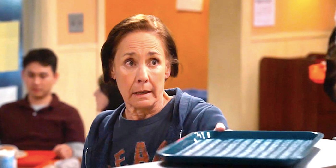 Laurie Metcalf's Jackie hands someone offscreen a tray in The Conners season 6