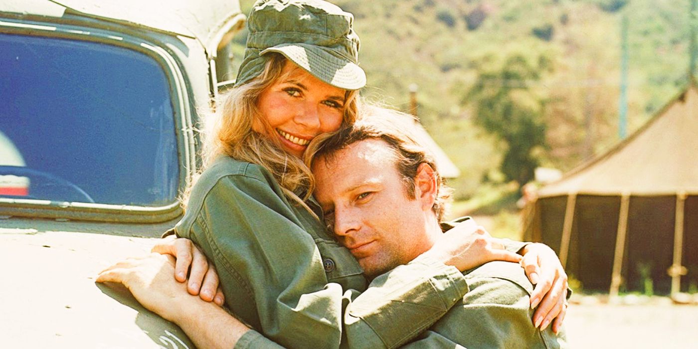 Loretta Swit as Margaret Houlihan and Larry Linville as Frank Burns hugging in MASH