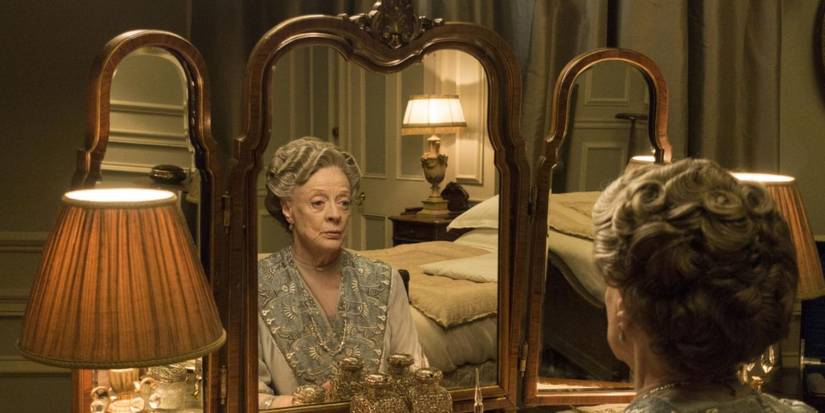 Maggie Smith looking in a mirror in Downton Abbey