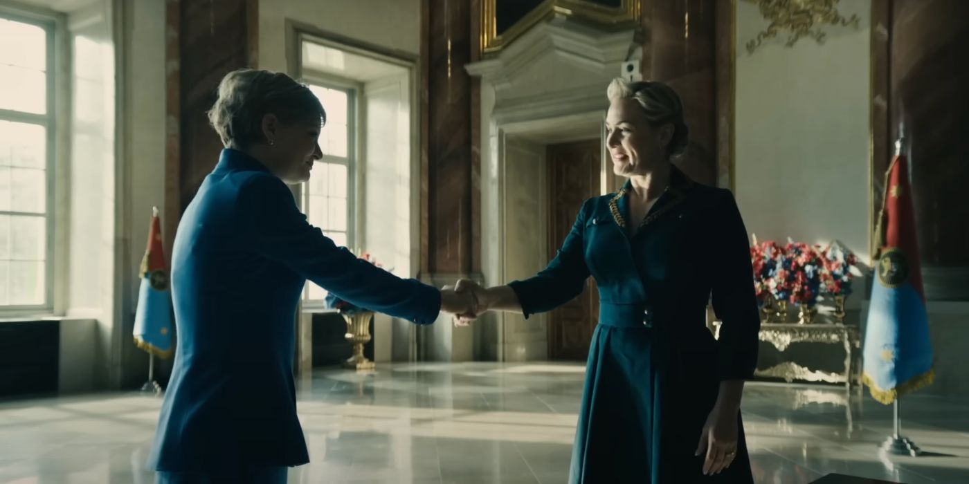 Martha Plimpton's Judith Holt shaking hands with Chancellor Elena (Kate Winslet) in The Regime