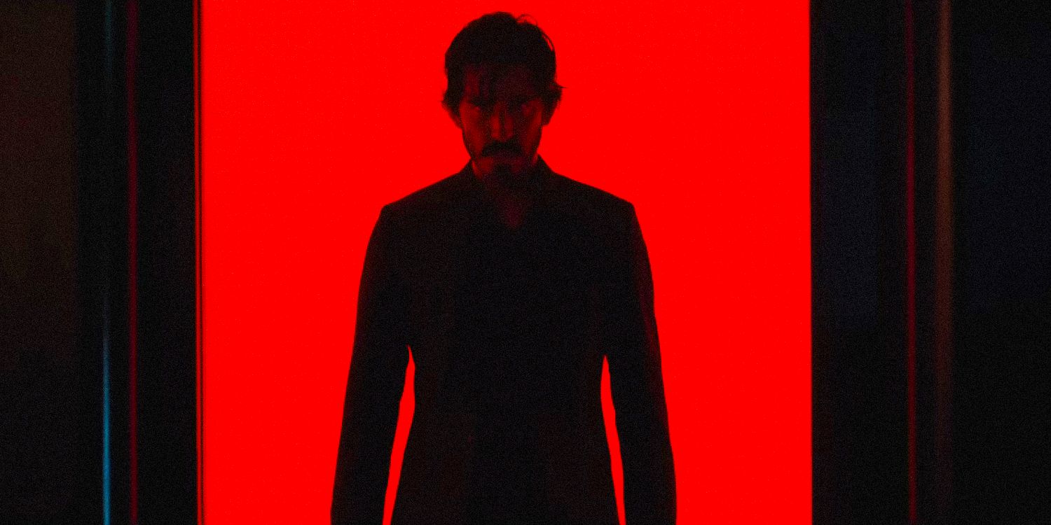 Dev Patel as Kid with a red illuminated background in Monkey Man trailer 2