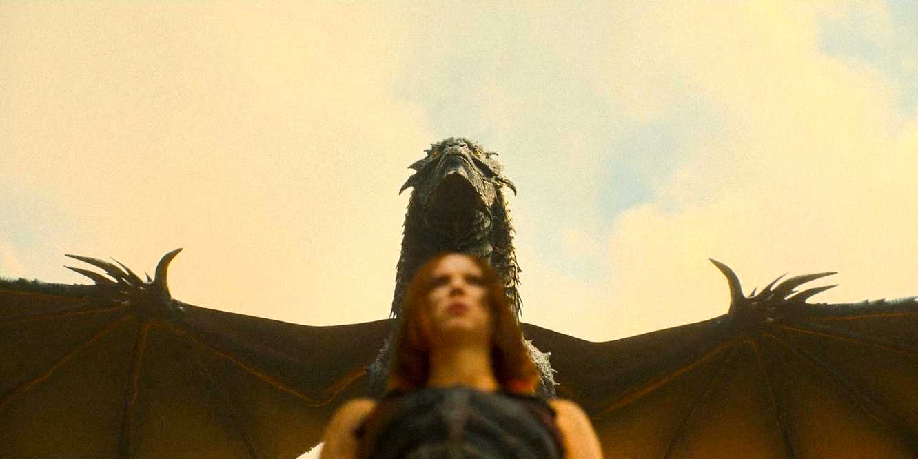 Elodie and the dragon walking by in Damsel